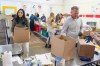 Volunteers work at the Food Banks Canada distribution centre in Toronto, Thursday, Oct. 24, 2024. THE CANADIAN PRESS/Chris Young