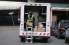 A Canada Post employee delivers parcels in Toronto, Wednesday, Nov. 13, 2024. Teamsters Canada says if Canada Post workers go on strike or are locked out on Friday, its members at Purolator won't handle any packages postmarked or identified as originating from the carrier in a show of solidarity. THE CANADIAN PRESS/Chris Young