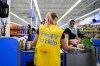 People shop at a Walmart in Vaughan, Ont., during sensory hours, which are select hours that accommodate people who want a quieter shopping experience, on Wednesday, July 2, 2024. Retail organizations are applauding a move to temporarily stop charging the federal sales tax on many items, but say the decision means some businesses have their work cut out for them. THE CANADIAN PRESS/Christopher Katsarov