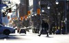 A person makes their way across Bank Street in downtown Ottawa, Monday, Nov. 25, 2024. THE CANADIAN PRESS/Sean Kilpatrick