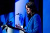 Alberta Premier Danielle Smith delivers a speech prior to a fireside chat during a Canada Strong and Free Network event in Ottawa, on Friday, April 12, 2024. Alberta Premier Danielle Smith says it’s early days on figuring out how the province will patrol its border with Montana but says there are options, and pointed to existing specialized sheriff units as a model. THE CANADIAN PRESS/Spencer Colby