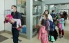 Ukrainian nationals fleeing the ongoing Russian invasion of Ukraine arrive in at the Richardson International Airport, in Winnipeg, Monday, May 23, 2022. THE CANADIAN PRESS/David Lipnowski
