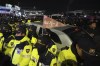 Police officers stand outside the National Assembly in Seoul, South Korea, Wednesday, Dec. 4, 2024. (AP Photo/Lee Jin-man)
