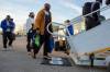 BROOK JONES / FREE PRESS
                                Willie Jefferson and his Blue Bombers teammates board their flight to Vancouver on Monday for their fifth consecutive Grey Cup appearance.