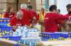 MIKE DEAL / FREE PRESS
                                Volunteers from CIBC pack up food hampers for The Christmas Cheer Board on Friday afternoon.