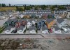 New single family houses billed as estate cottages and townhouses under construction are seen in an aerial view, in Delta, B.C., on Monday, Aug. 12, 2024. Canada is spending billions of dollars a year to address housing affordability, yet the number of households in core housing need is still rising. THE CANADIAN PRESS/Darryl Dyck