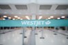 The WestJet check-in area at Pearson International Airport is photographed in Toronto, Saturday, June 29, 2024. THE CANADIAN PRESS/Christopher Katsarov