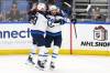 Jeffrey T. Barnes / The Associated Press
                                Jets captain Adam Lowry (right) celebrates with Gabriel Vilardi on Thursday after notching in the game-winning overtime goal against the Sabres in Buffalo.