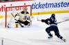 FRED GREENSLADE / THE CANADIAN PRESS
                                Mark Scheifele scores on Boston Bruins goaltender Jeremy Swayman during the first period of their hockey game in Winnipeg.