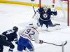 Winnipeg Jets goaltender Connor Hellebuyck (37) saves the shot from Montreal Canadiens&rsquo; Patrik Laine (92) during first period NHL action in Winnipeg, Saturday, Dec. 14, 2024. (John Woods / The Canadian Press files)