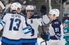 Tony Avelar / The Associated Press
                                Winnipeg Jets&rsquo; Mark Scheifele, centre, celebrates his power play goal against the San Jose Sharks with teammates Gabriel Vilardi and Cole Perfetti in the second period.