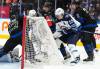 NATHAN DENETTE / THE CANADIAN PRESS
                                Jets centre Mark Scheifele digs out the puck to score his second goal of the game from behind the net Monday against the Toronto Maple Leafs.