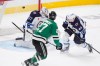 Dallas Stars left wing Mason Marchment (27) scores a goal against Winnipeg Jets goaltender Connor Hellebuyck (37) and defenseman Josh Morrissey (44) during the third period of an NHL hockey game Sunday, Dec. 1, 2024, in Dallas. (AP Photo/LM Otero)