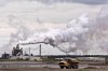 A dump truck works near the Syncrude oil sands extraction facility near the city of Fort McMurray, Alberta on Sunday June 1, 2014. THE CANADIAN PRESS/Jason Franson