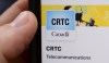 A person navigates to the on-line social-media pages of the Canadian Radio-television and Telecommunications Commission (CRTC) on a cell phone in Ottawa on May 17, 2021. THE CANADIAN PRESS/Sean Kilpatrick