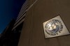 FILE - The International Monetary Fund building, Monday, April 5, 2021, in Washington. (AP Photo/Andrew Harnik, File)