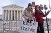 FILE - Sarah Baus, left, of Charleston, S.C., and Tiffany Cianci, who says she is a 