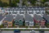 New single family houses billed as estate cottages and townhouses under construction are seen in an aerial view, in Delta, B.C., on Monday, Aug. 12, 2024. THE CANADIAN PRESS/Darryl Dyck