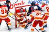Calgary Flames goaltender Dustin Wolf (32) saves a shot during third period NHL action against the Winnipeg Jets in Winnipeg on Saturday, January 18, 2025. THE CANADIAN PRESS/John Woods