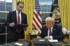 President Donald Trump signs an executive order regarding the southern border in the Oval Office of the White House, in Washington, Monday, Jan. 20, 2025. THE CANADIAN PRESS/AP-Evan Vucci