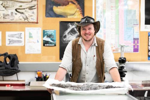 MIKAELA MACKENZIE / FREE PRESS
                                Vertebrate paleontologist Maximilian Scott handles the fossilized jaw of a tylosaurus (a type of mosasaur) jaw in the University of Manitoba paleontology lab.