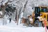 Residents and city crews begin clearing snow after a heavy snowfall in December. (Mike Deal / Free Press files)