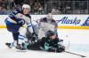 Lindsey Wasson / The Associated Press files
                                Jets defenceman Logan Stanley ties up Kraken forward Jaden Schwartz in front of Connor Hellebuyck&rsquo;s net.