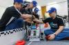 Blue team members Cody Dueck (from left), Josh Hildebrandt, Kayden Grattan and Andrew Hildebrandt rush to make a repair during testing. (Mike Deal / Free Press)