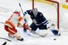 Fred Greenslade / The Canadian Press
                                Winnipeg Jets&rsquo; goaltender Eric Comrie makes one of his 20 saves against Calgary Flames&rsquo; Blake Coleman during NHL action in Winnipeg on Sunday.
