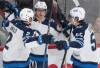 Christinne Muschi / THE CANADIAN PRESS
                                Winnipeg Jets&rsquo; Kyle Connor celebrates his goal against the Montreal Canadiens with teammates Dylan DeMelo and Mark Scheifele during the first period in Montreal on Tuesday.
