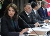 Alberta Premier Danielle Smith, left, talks with colleagues during the fall meetings of Canada's premiers hosted by Ontario in Toronto, Monday, Dec. 16, 2024. THE CANADIAN PRESS/Nathan Denette