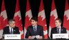 Ottawa Mayor Mark Sutcliffe, left, and London Mayor Josh Morgan, right, look on as Prime Minister Justin Trudeau speaks to the Federation of Canadian Municipalities’ Big City Mayors Caucus meeting, Thursday, Feb. 6, 2025 in Ottawa. THE CANADIAN PRESS/Adrian Wyld