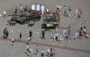 FILE - People visit an open-air exhibition of damaged and burnt-out Russian tanks and armored vehicles at the Castle Square, in Warsaw, Poland, June 27, 2022. (AP Photo/Michal Dyjuk, File)