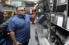 Raul Luis checks an order at his Birrieria Chalio Mexican Restaurant in Fort Worth, Texas, Thursday, Feb. 13, 2025. (AP Photo/LM Otero)