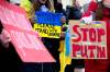 MIKE SUDOMA / FREE PRESS
                                Supporters of Ukraine hold signs as they gather outside of the Canadian Museum for Human rights while a ceremony marking the 3rd anniversary of Russians invasion of Ukraine continues inside of the museum Sunday afternoon February 23, 2024