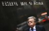 FILE - A man walks past the Reserve Bank of Australia in Sydney, on Aug. 2, 2016. (AP Photo/Rick Rycroft, File)