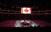 Players and fans stand for the Canadian national anthem prior to first period 4 Nations Face-Off hockey action between Canada and the United States in Montreal on Saturday, Feb. 15, 2025. THE CANADIAN PRESS/Christinne Muschi