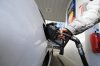 A person pumps gas into their vehicle at a gas station in Mississauga, Ont., Tuesday, Feb. 13, 2024. THE CANADIAN PRESS/Christopher Katsarov