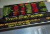 Financial numbers flow on the digital ticker tape at the TMX Group in Toronto's financial district on May 9, 2014. THE CANADIAN PRESS/Darren Calabrese