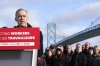 Unifor autoworkers stand behind Liberal Leader Mark Carney as he speaks during a campaign stop at the Ambassador Bridge in Windsor, Ont., on Wednesday, March 26, 2025. THE CANADIAN PRESS/Frank Gunn