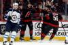 Carolina Hurricanes&rsquo; Mark Jankowski, center, celebrates with teammates after his goal against the Winnipeg Jets during the first period of an NHL hockey game in Raleigh, N.C., Sunday, March 9, 2025. (Karl DeBlaker / The Associated Press)