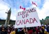 A participant holds an &ldquo;Elbows Up Canada&rdquo; sign during rally in response to U.S. President Donald Trump&rsquo;s threats to Canadian sovereignty, on Parliament Hill in Ottawa, on Sunday, March 9, 2025. (Justin Tang / The Canadian Press files)