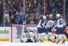 THE CANADIAN PRESS/Darryl Dyck
                                Vancouver Canucks players celebrate a first-period goal against Winnipeg Jets goalie Connor Hellebuyck as Dylan DeMelo, Dylan Samberg and Nino Niederreiter look on in the Jets 6-2 loss Tuesday in Vancouver.
