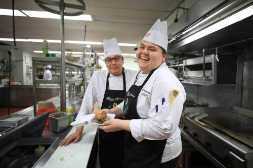 Ruth Bonneville / Free Pres
                                Gabriel Nanacowop (left) and Kendrah Sinclair finish preparing lunch with their 
classmates for guests at Wiisinin Diner.