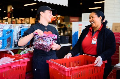 Employees at Red River Cooperative share a laugh while at work.