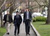 NDP Leader Jagmeet Singh, centre walks with B.C. Premier David Eby following a federal election campaign stop in Victoria, B.C. on Monday, March 31, 2025. Eby has appeared in a video posted on Singh's X social media account alongside the federal leader, asking voters in B.C. to 