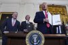President Donald Trump holds a signed an executive order during an event in the East Room of the White House, in Washington, Tuesday, April 8, 2025. THE CANADIAN PRESS/AP-Evan Vucci