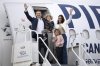 Federal Conservative Leader Pierre Poilievre waves with his family before boarding his campaign plane at the John C. Munro Hamilton International Airport in Hamilton, Ont., on Wednesday, March 26, 2025. THE CANADIAN PRESS/Nick Iwanyshyn