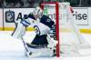 Connor Hellebuyck blocks a shot during the second period. (Kyusung Gong / The Associated Press)