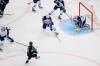 Utah centre Clayton Keller shoots and scores on goaltender Connor Hellebuyck during the first period Saturday in Salt Lake City. (Tyler Tate / The Associated Press)